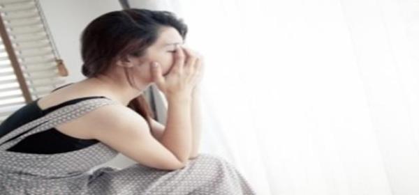 Sad Woman Sitting Alone